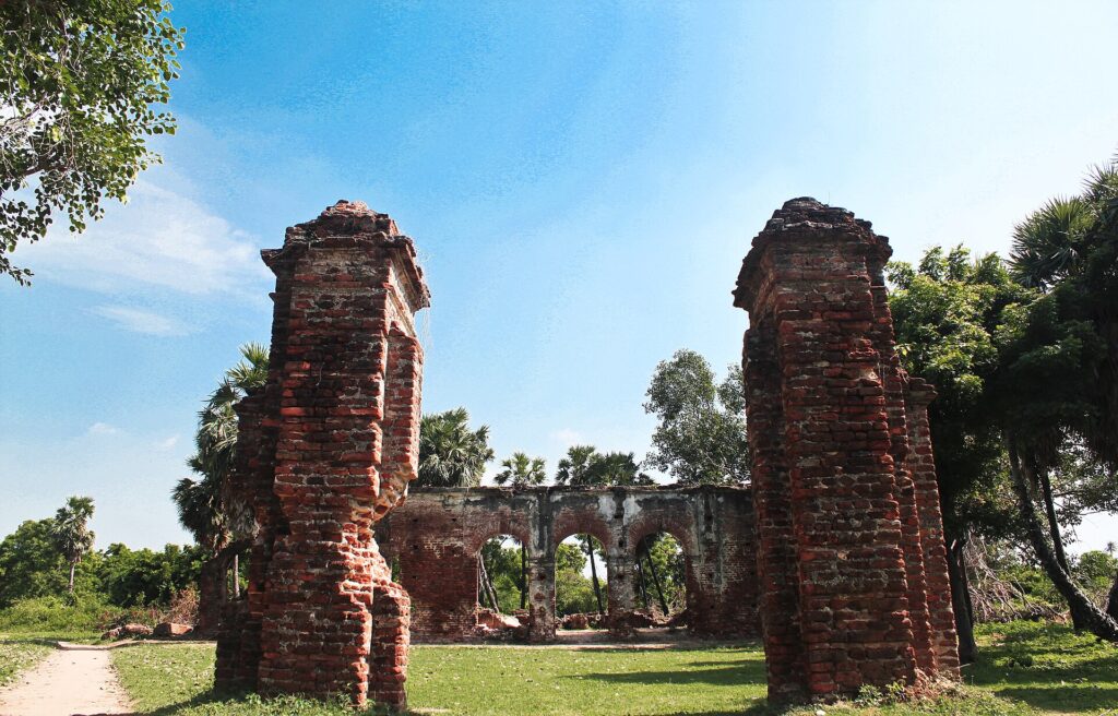 Brick gateposts and arches of the old Jesuit mission ruins, the main sight on an Arikamedu scooter ride