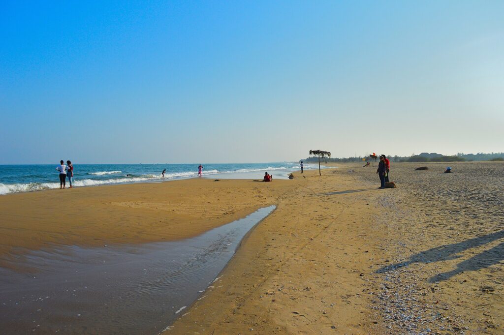 Wide golden sand and gentle waves at Paradise Beach Chunnambar south of Pondicherry